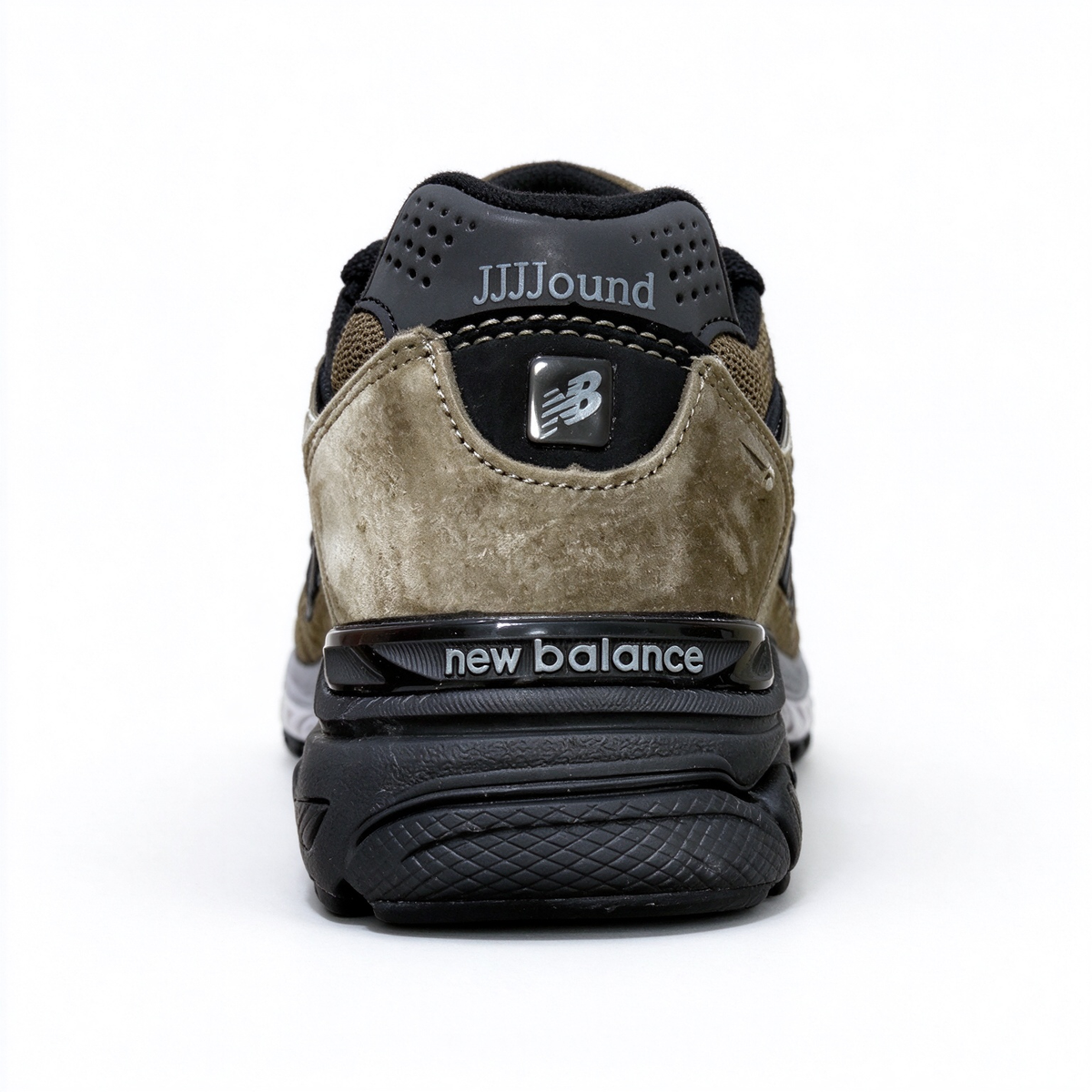 JJJJound x New Balance 990v3 classic collaboration model, Made in USA style. Premium brown suede matched with breathable mesh fabric, iconic dark black overlay, low-key vintage aesthetic, highly versatile for streetwear outfits.