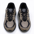 JJJJound x New Balance 990v3 classic collaboration model, Made in USA style. Premium brown suede matched with breathable mesh fabric, iconic dark black overlay, low-key vintage aesthetic, highly versatile for streetwear outfits.