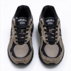 JJJJound x New Balance 990v3 classic collaboration model, Made in USA style. Premium brown suede matched with breathable mesh fabric, iconic dark black overlay, low-key vintage aesthetic, highly versatile for streetwear outfits.