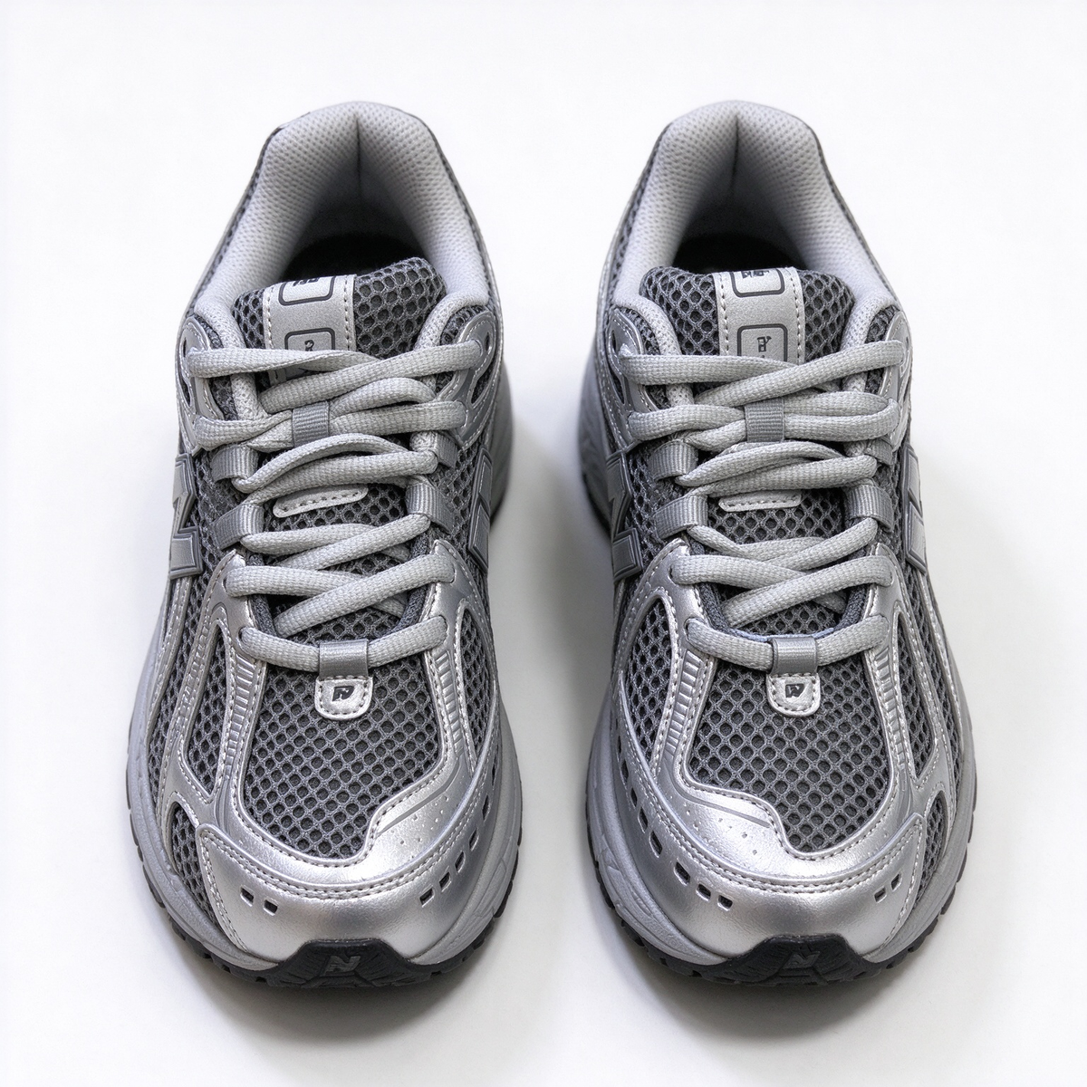 New Balance Classic Y2K retro running sneakers 1906R silver grey metallic colorway, unisex dad shoes for men and women.